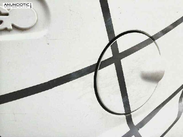 Tapa exterior combustible de